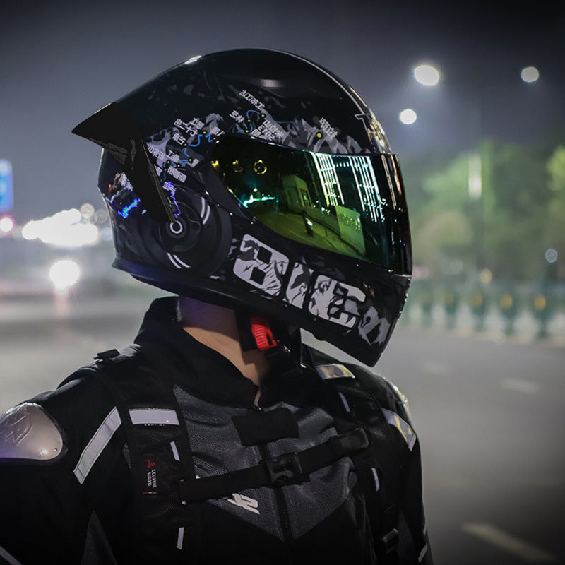 Rider wearing the Static full-face helmet on a lit street at night