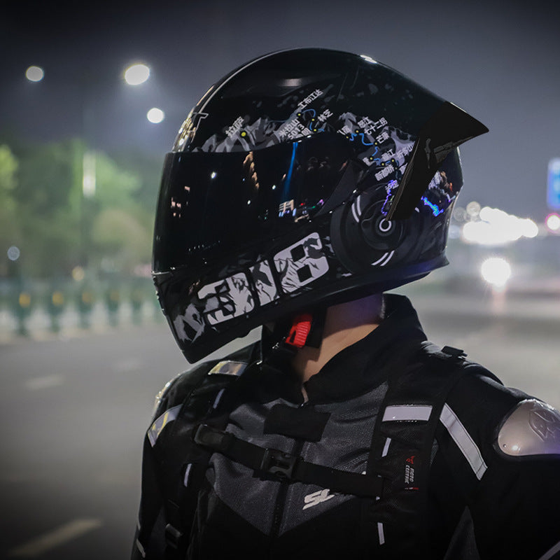 Rider wearing the Static full-face helmet at night, three-quarter rear view
