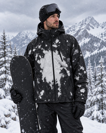 Snowboarder wearing the Flashpoint color changing jacket in Frost as a ski shell, white splashes where snow landed