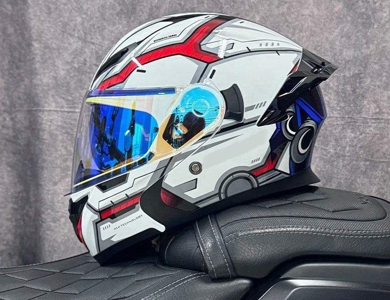 Pivot flip-up motorcycle helmet, white shell with red and blue graphics, fitted with the blue iridescent outer shield