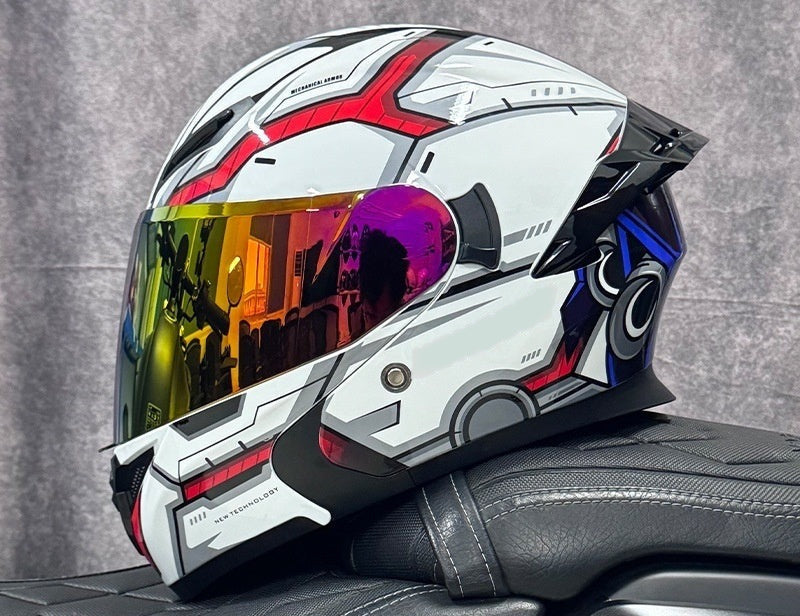 Pivot flip-up motorcycle helmet, white shell with red and blue graphics, fitted with the gold mirror outer shield