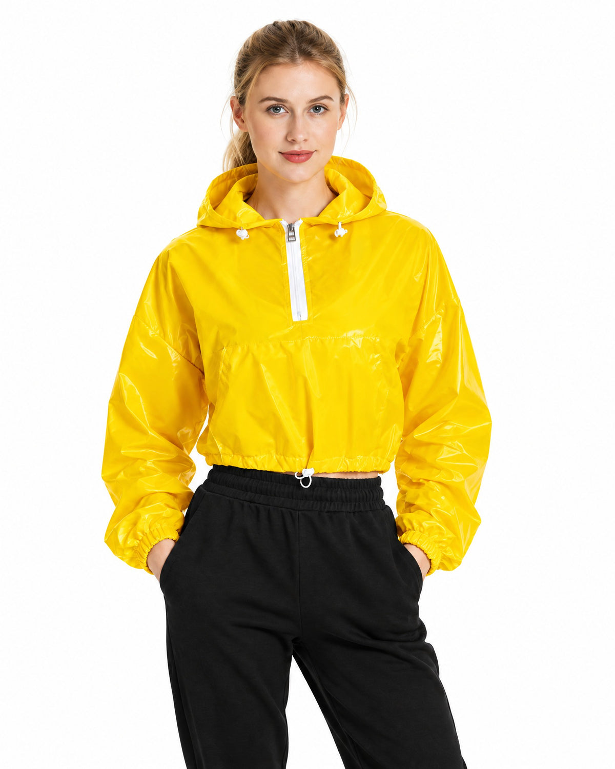 Women's reflective cropped hooded jacket in Gold yellow with white zip, daylight studio view