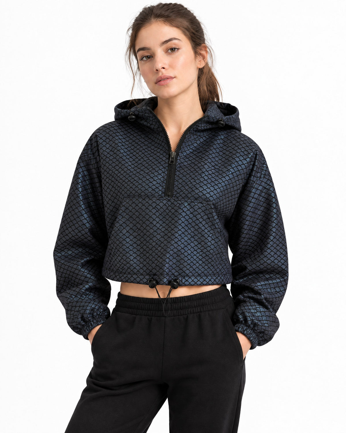 Women's reflective cropped hooded jacket in Scale, charcoal with fish-scale texture in daylight