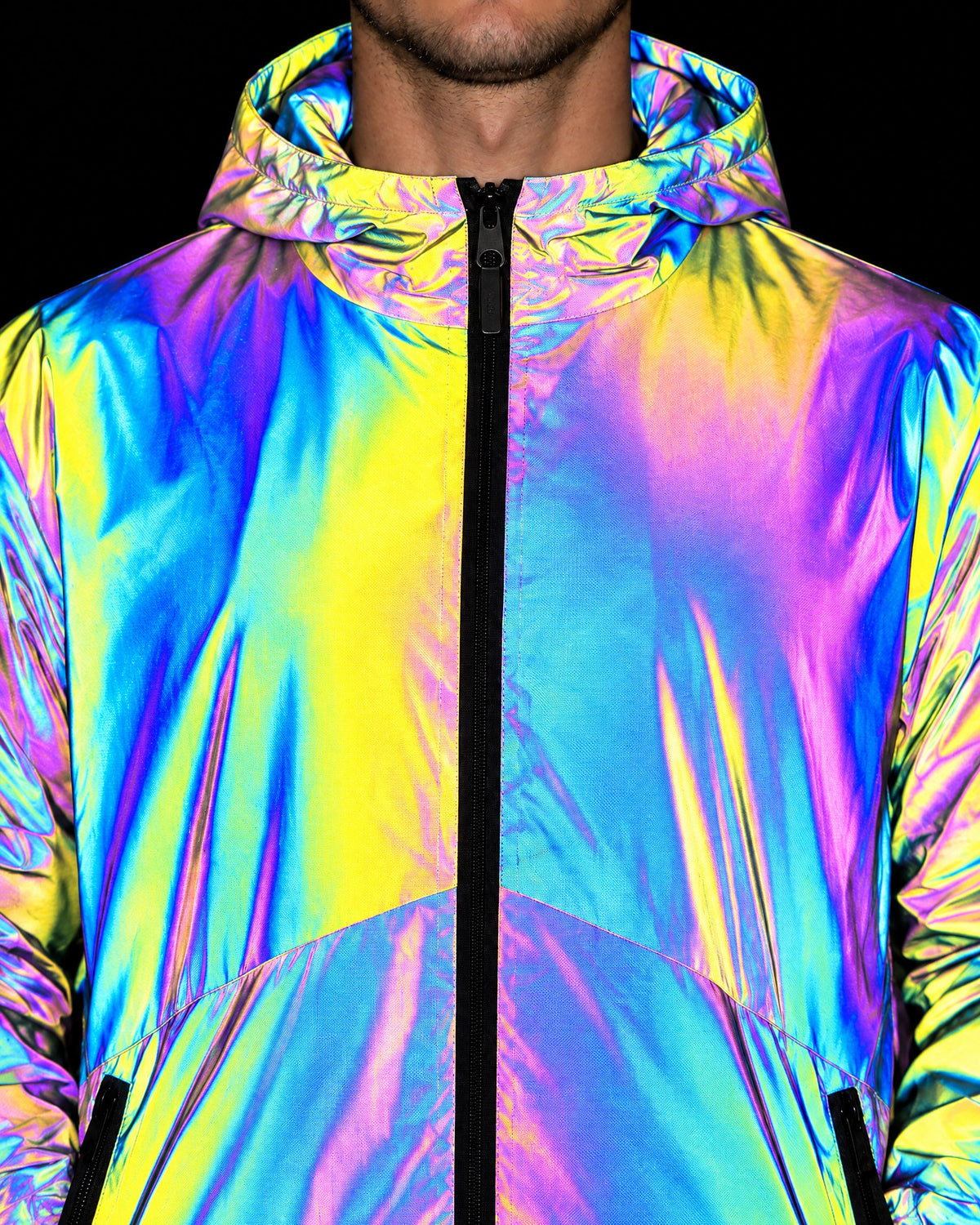Close-up of the full-length zip, hood and zip pocket on the men's reflective jacket