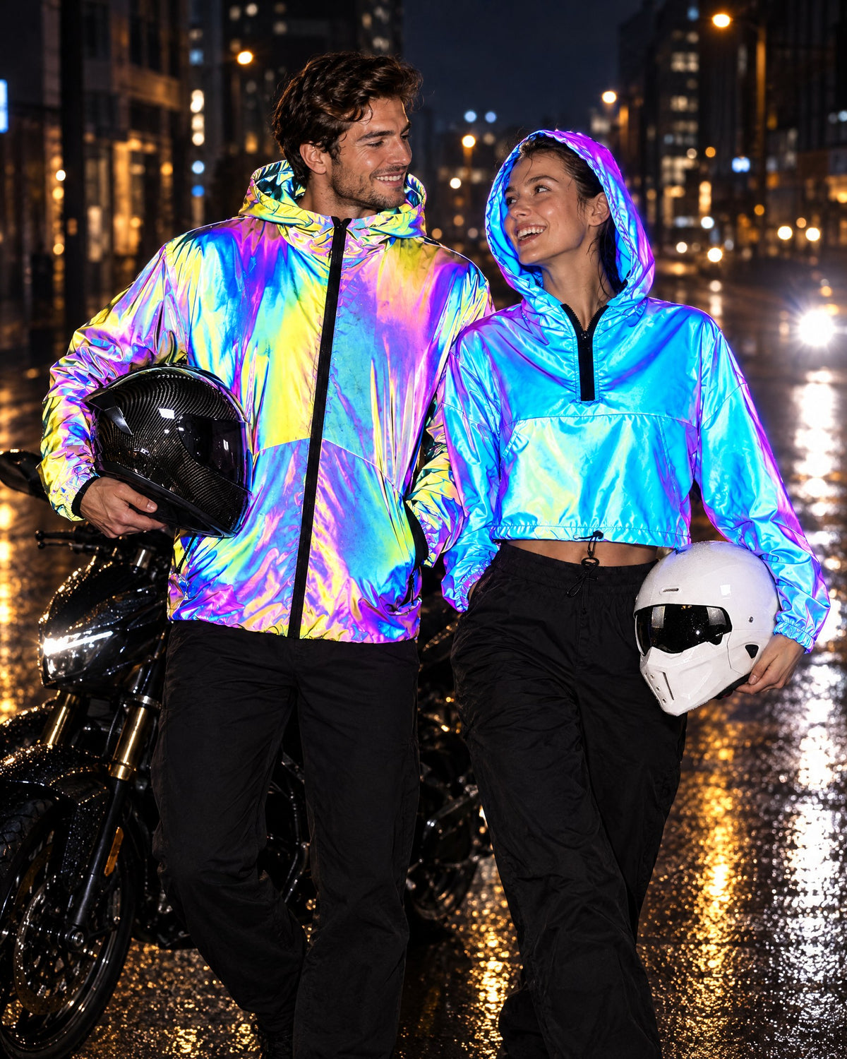 Couple in matching NIGHTGRID reflective jackets beside a motorcycle at night